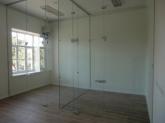Glass partitions with pivot doors